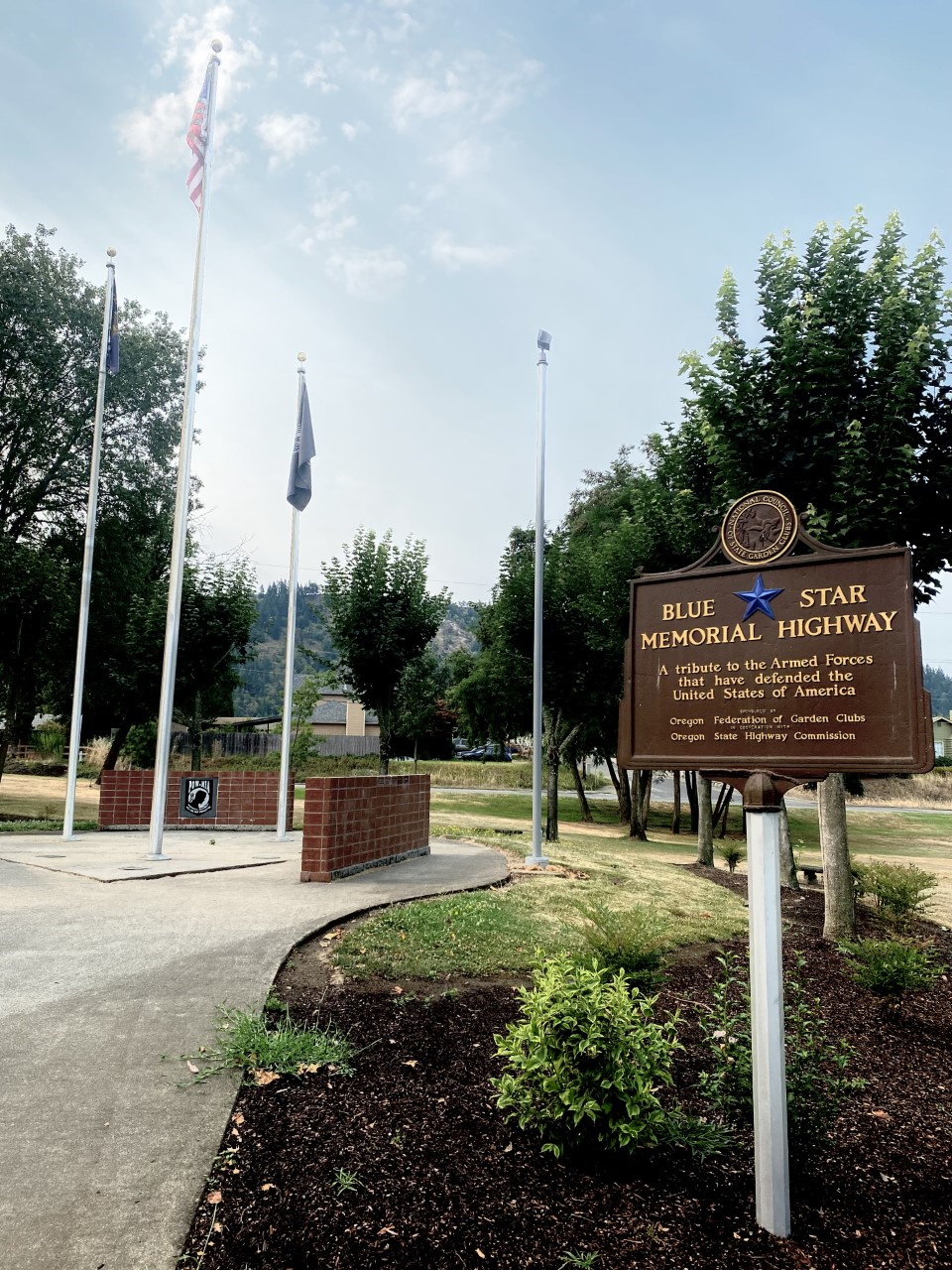 community park memorial sign and flags