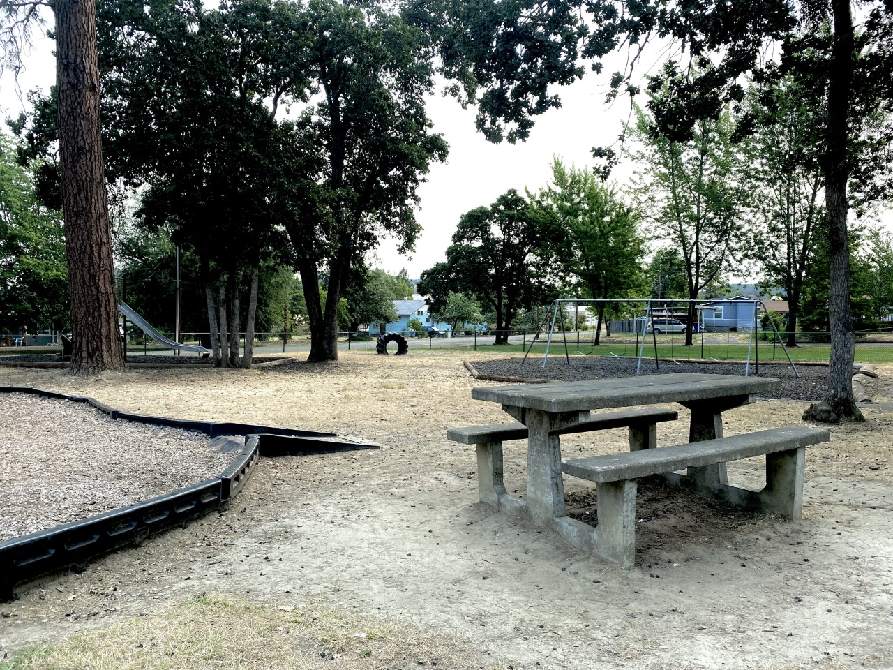 community park picnic table view play ground
